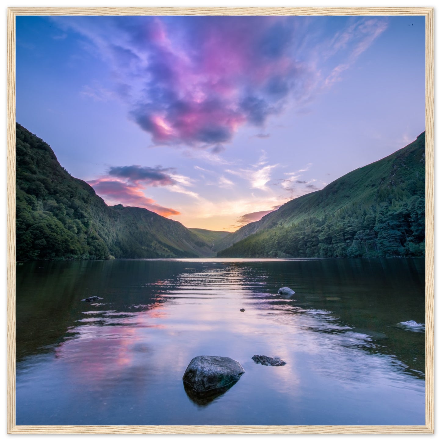 Framed wall art print of Glendalough Valley, featuring the Upper Lake at dusk with serene sky reflections, in a wooden frame.