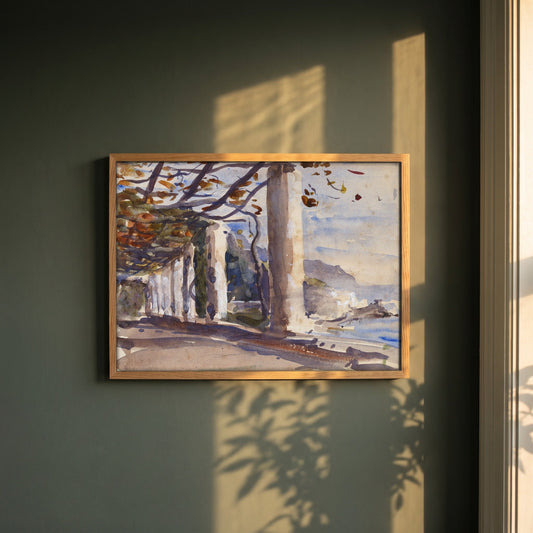 A Vine Pergola on Amalfi, Italy framed print in a natural oak frame on a dark green wall beside a window, dappled plant shadow