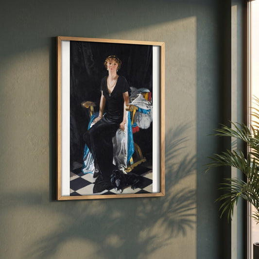 Idina Wallace framed print in a natural oak frame on a dark green wall beside a window, dappled plant shadow