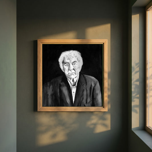 Seamus Heaney framed print in a natural oak frame on a dark green wall beside a window, dappled plant shadow