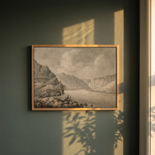 The Upper Lake, Glendalough framed print in a natural oak frame on a dark green wall beside a window, dappled plant shadow