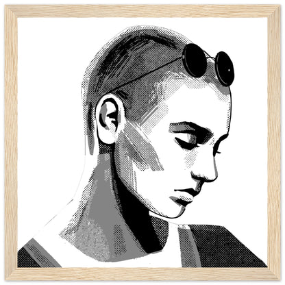 Framed Sinéad O'Connor portrait in a light oak frame, downcast eyes and sunglasses on her head