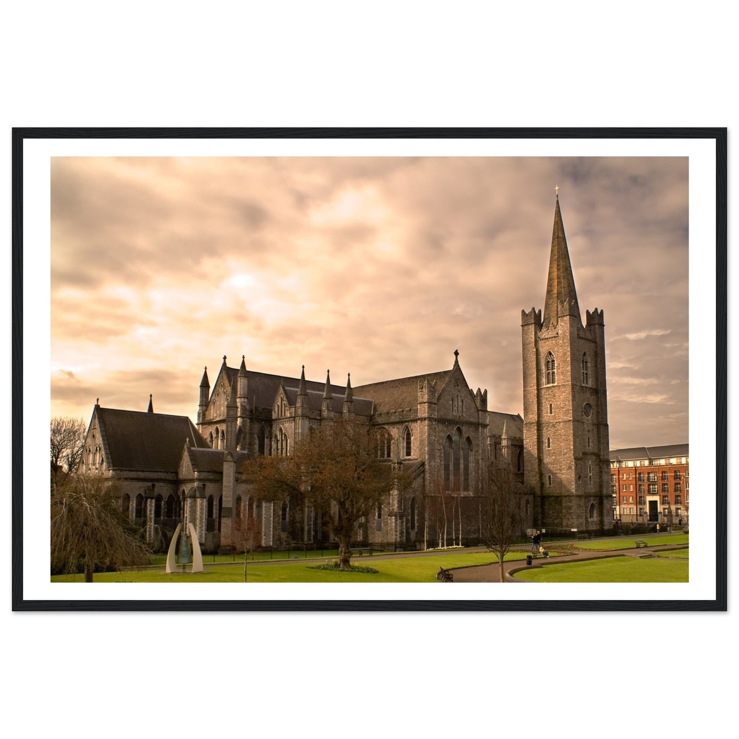 Framed print of St. Patrick's Cathedral in Dublin, showcasing its majestic Gothic architecture with detailed spires and intricate stonework. The serene scene captures the historic beauty of Ireland's largest cathedral, perfect for enhancing any living space.