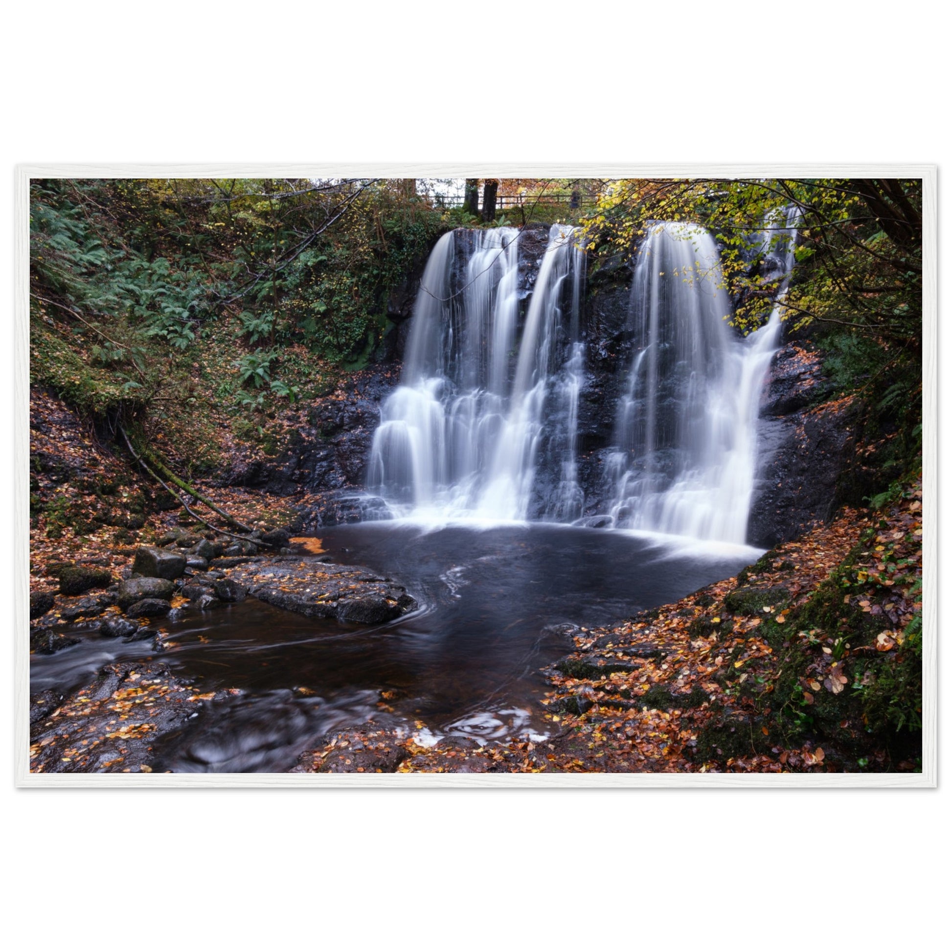 Framed print of Glenariff Waterfall, capturing the serene beauty of cascading water amidst lush greenery in the Glens of Antrim, Northern Ireland. Known as the 'Queen of the Glens,' this stunning landscape print brings nature's tranquility into your home.