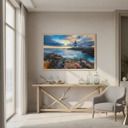Boutique hotel lobby on the Irish coast; Hook Head Lighthouse print hung over a console table with driftwood and glass vessels.