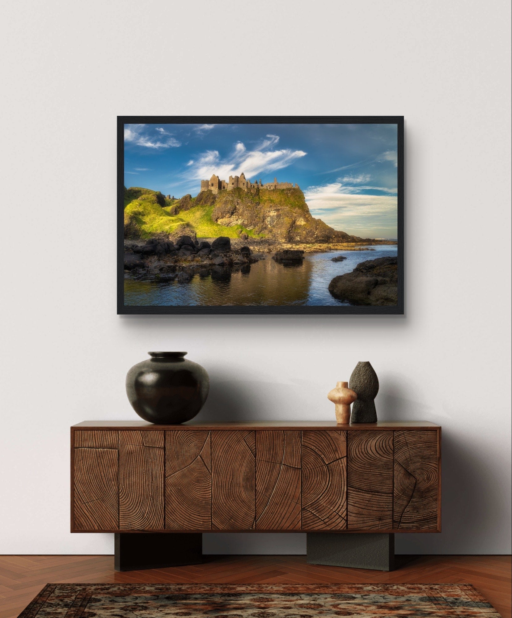 Framed wall art print of Dunluce Castle, showcasing its majestic ruins perched on a rugged cliff overlooking the sea. The detailed image captures the historic architecture and breathtaking coastal scenery, perfect for adding a touch of history and beauty to any room.