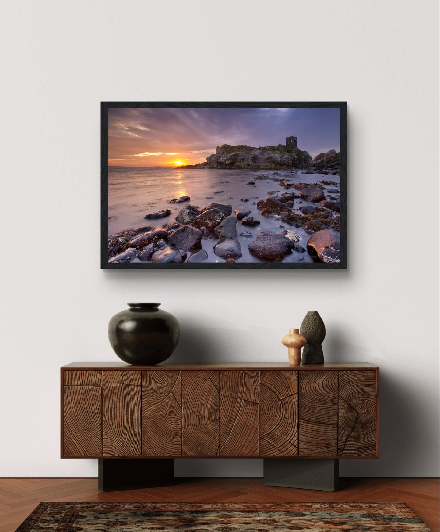 A framed print of Kinbane Castle perched on a dramatic cliffside, overlooking the crashing waves of the North Atlantic. This stunning coastal wall art captures the rugged beauty and historical charm of Ireland, perfect for adding a touch of history to any space.