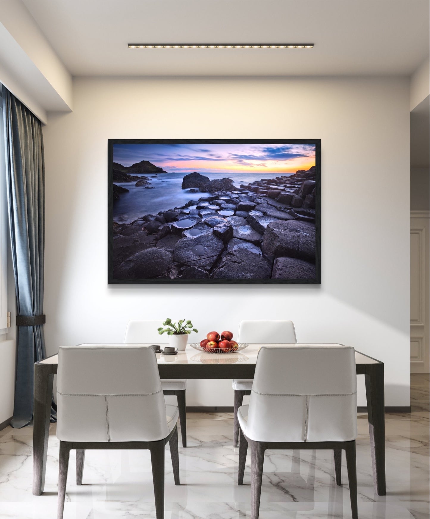 Framed art print of a breathtaking sunset at Giant's Causeway. Features iconic basalt columns against a warm, colorful sky. Perfect for adding sophistication and natural beauty to any home or office decor. Ideal for nature and art enthusiasts.