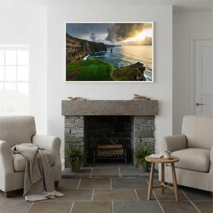 Large 60×90 cm framed Cliffs of Moher print above a limestone fireplace in an Irish coastal cottage with white walls, slate floors and linen armchairs.