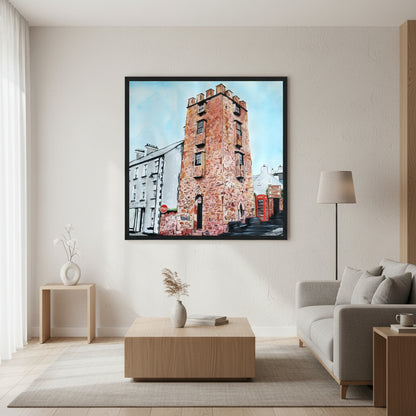 A museum-quality framed art print of The Curfew Tower Cushendall displayed in a refined contemporary living room Irish Artist by Ó Maoláin. This piece depicts The Curfew Tower in Cushendall, Glens of Antrim, built by Francis Turnley in 1820 and now owned by Bill Drummond. soft natural window light, minimalist high-end décor, oak furniture, matte 250gsm paper texture visible, premium editorial photography.