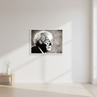 White framed Seamus Heaney print on a crisp white wall in a bright home office wall.