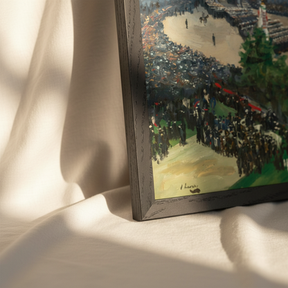 Detail of the Admiralty Arch Victory Parade print in a black frame resting on cream fabric in sunlight