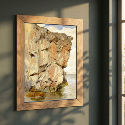 A Cliff at Howth, County Dublin framed print in a natural oak frame on a dark green wall beside a window, dappled plant shadow