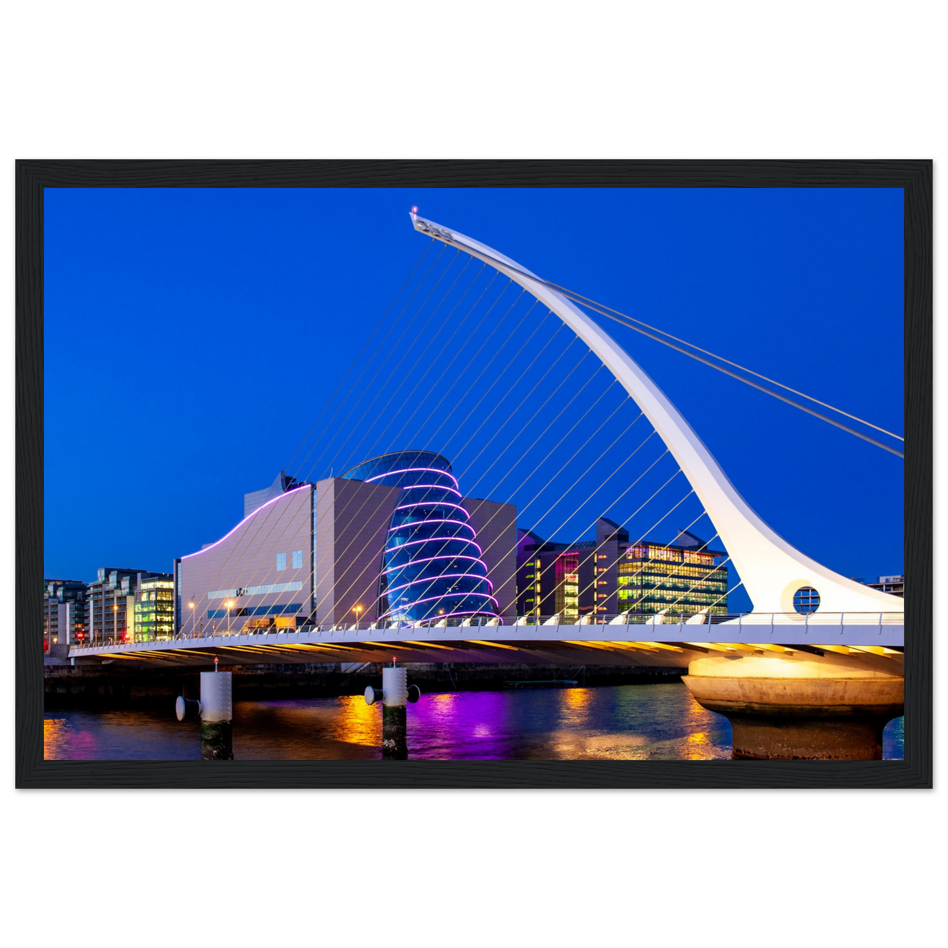 Enchanting Dublin skyline at night: Samuel Beckett Bridge & Convention Centre lights reflected on River Liffey. Framed art print captures city's magic.