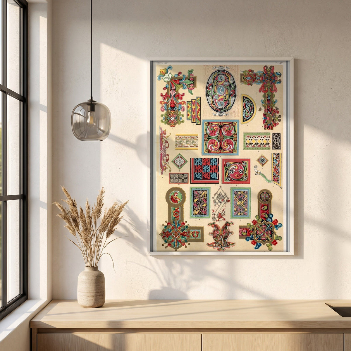 Celtic No.3 (1856) by Owen Jones framed print in a white frame on a plaster wall above an oak worktop in a bright Scandinavian kitchen