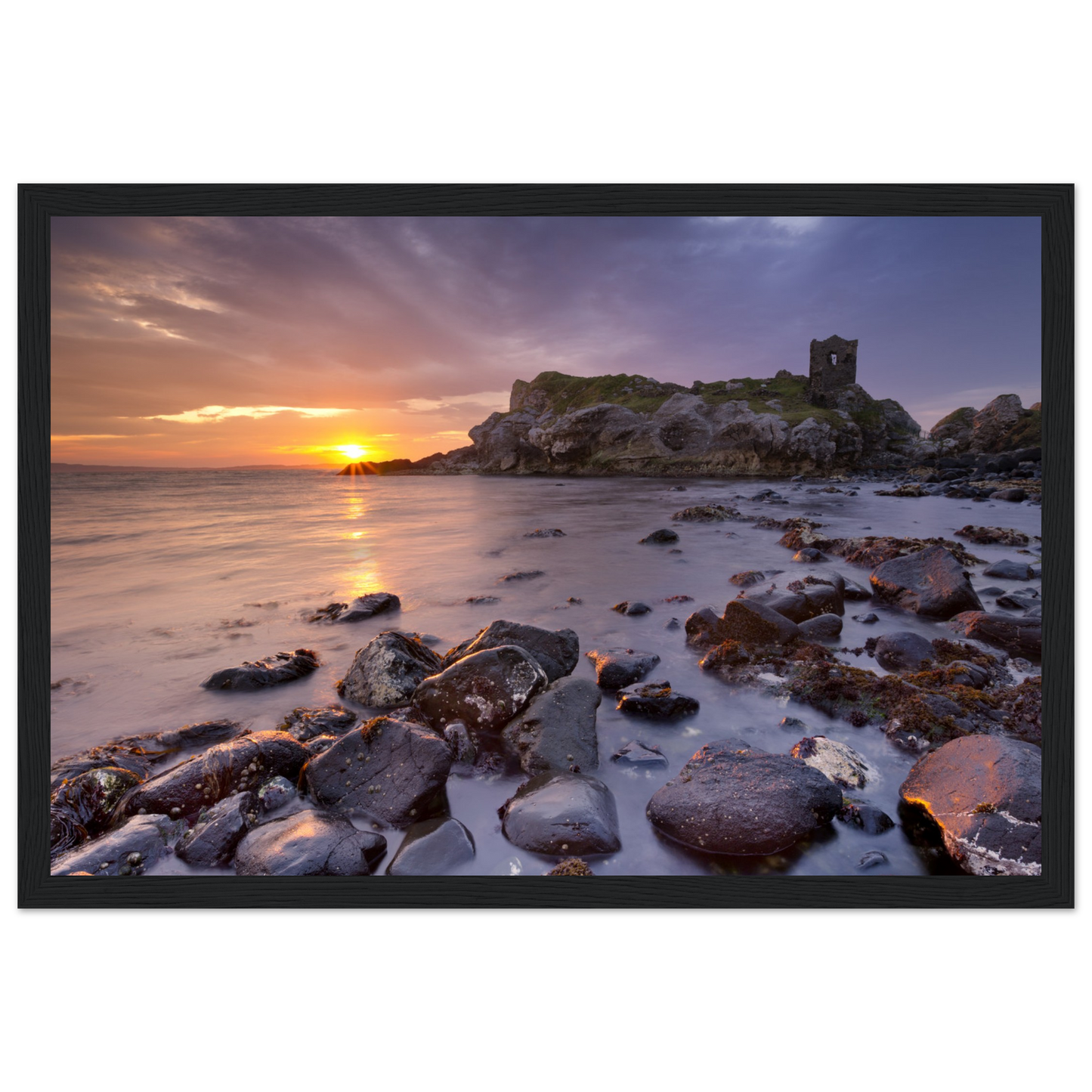 Framed wall art print of Kinbane Castle showcasing dramatic cliffside ruins above the North Atlantic waves. Perfect for adding a touch of Irish history and coastal charm to any space. Ideal for history lovers and those who appreciate Ireland's ancient beauty.