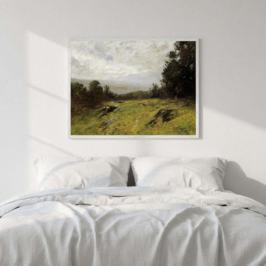 Edward Gay Hillside 1908 framed Irish-American landscape art print beside a bed with white linen.