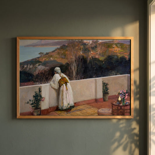 Evening, Tangier framed print in a natural oak frame on a dark green wall beside a window, dappled plant shadow