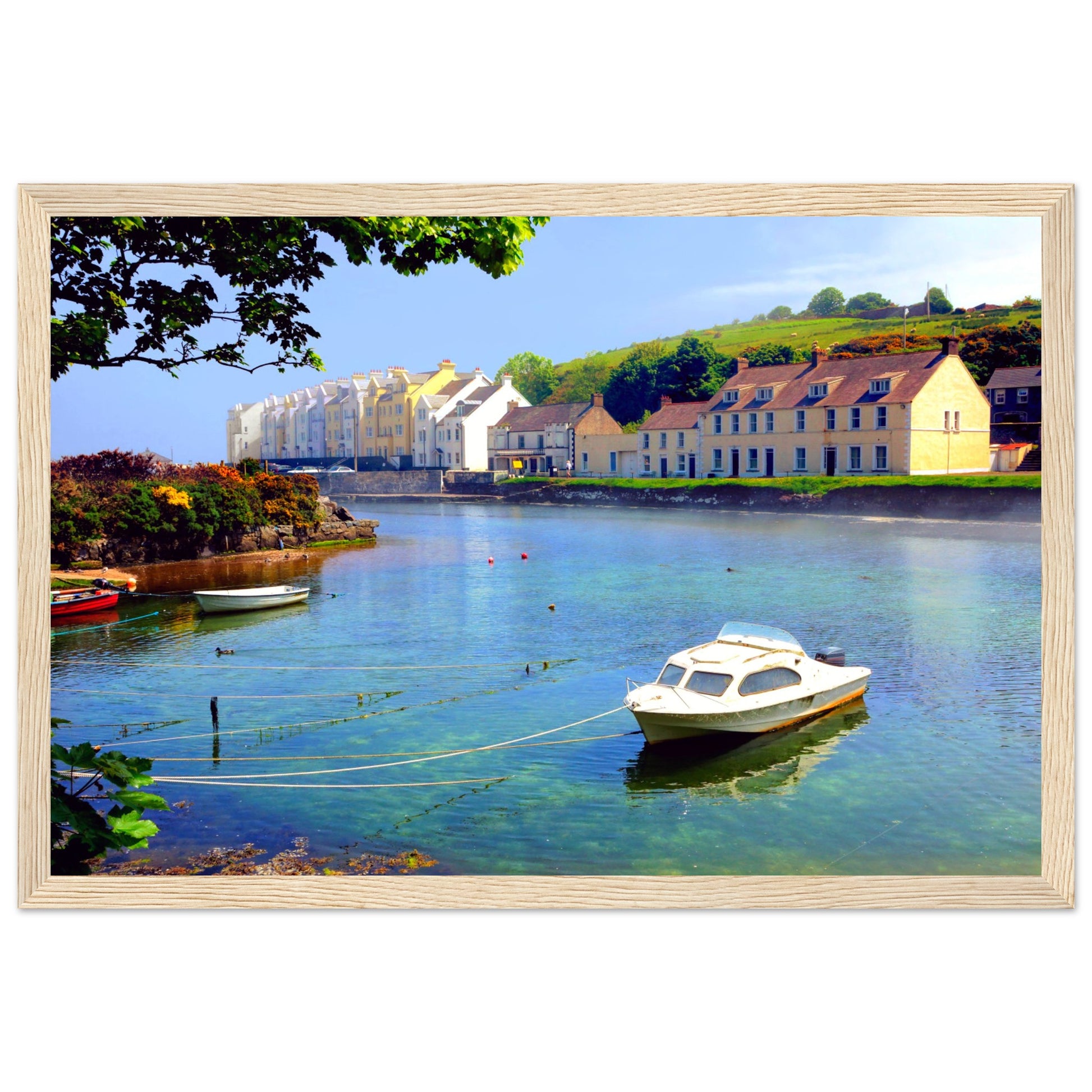 Serene coastal view of Cushendun, Northern Ireland at sunrise. Rustic wooden frame complements natural tones.