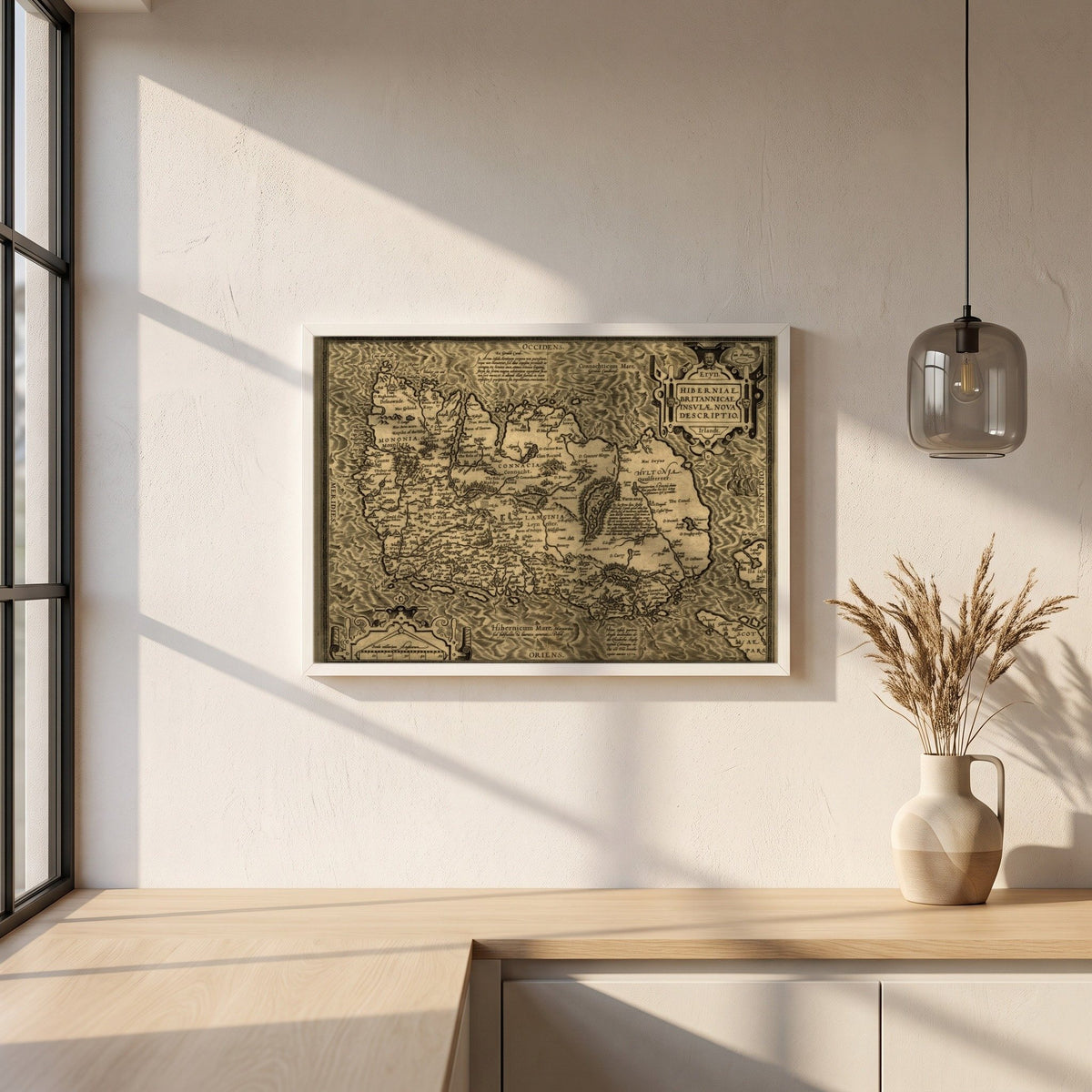 Hiberniae, Britannicae Insvlae nova descripto Ireland map framed print in a white frame on a plaster wall above an oak worktop in a bright Scandinavian kitchen