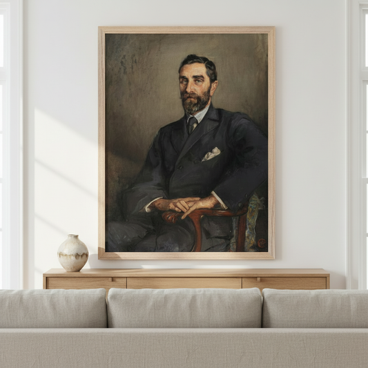 Roger Casement portrait by Sarah Purser in an oak frame above a low sideboard and grey sofa in a white room