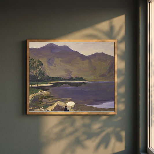 Loch Katrine framed print in a natural oak frame on a dark green wall beside a window, dappled plant shadow