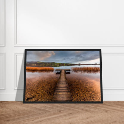 Old Jetty, Lough Derg photographic print in a black frame leaning against a panelled wall
