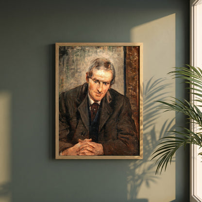 Portrait of Jack B. Yeats framed print in a natural oak frame on a dark green wall beside a window, dappled plant shadow