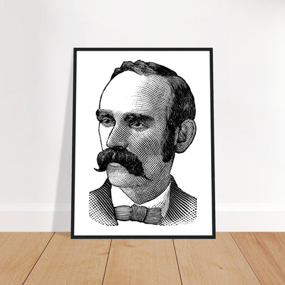 Portrait of Michael Davitt in a black frame leaning against a white wall on a wooden floor