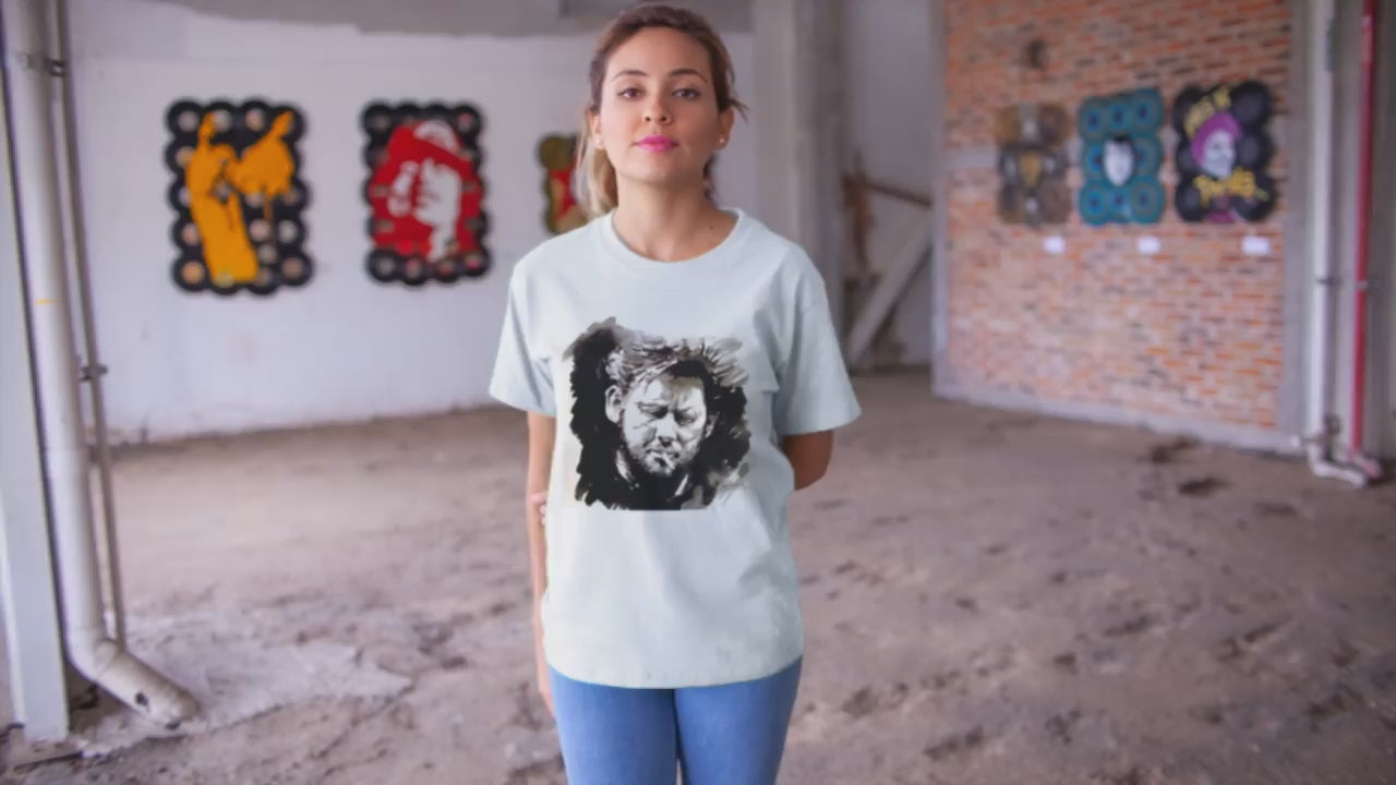 video of a girl wearing a Shane MacGowan T-Shirt featuring a bold portrait of the Irish folk music legend, capturing his iconic presence with a vintage vibe and rock and roll flair.