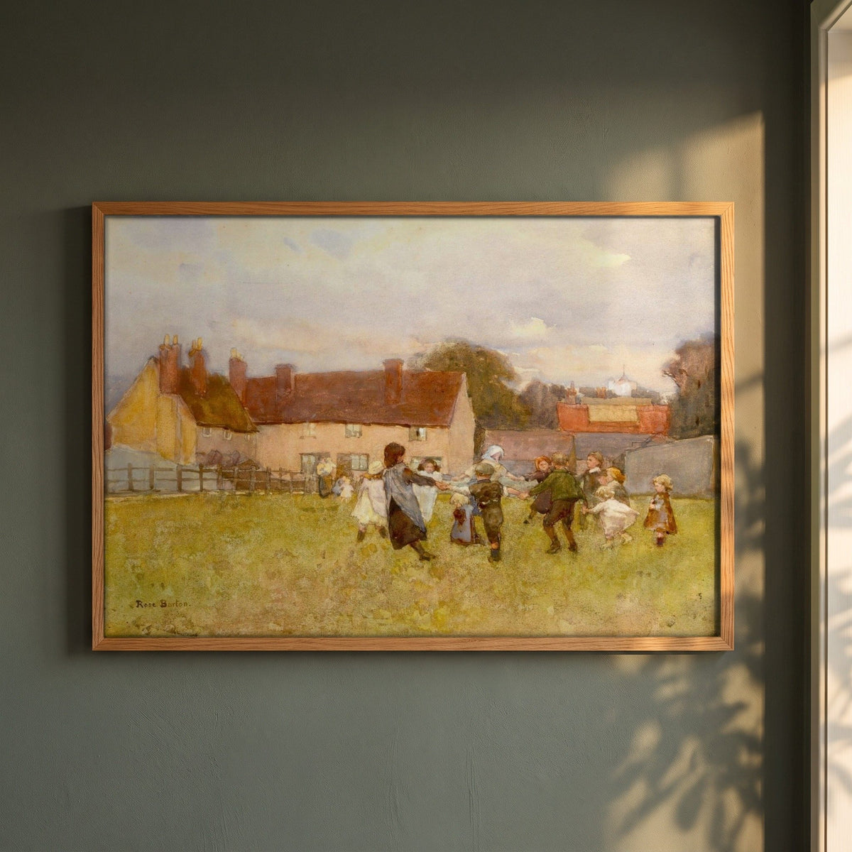 Here We Dance, Lubin Lubin framed print in a natural oak frame on a dark green wall beside a window, dappled plant shadow