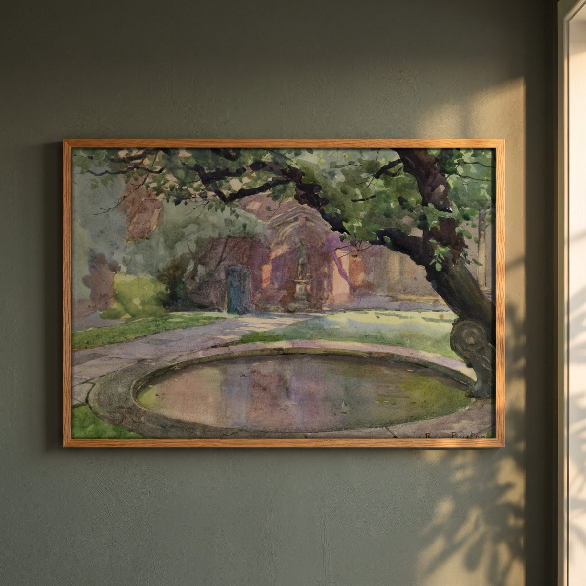The Garden of Lindsey House, London framed print in a natural oak frame on a dark green wall beside a window, dappled plant shadow