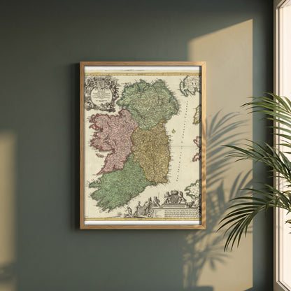 The Kingdom of Ireland map framed print in a natural oak frame on a dark green wall beside a window, dappled plant shadow