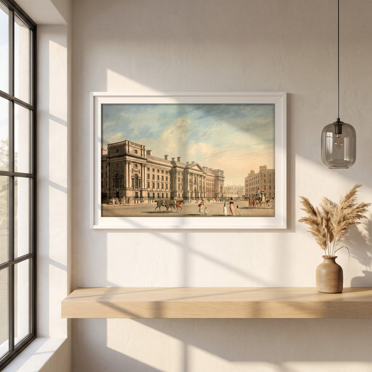 Trinity College, College Green by James Malton framed print in a white frame on a plaster wall above an oak worktop in a bright Scandinavian kitchen
