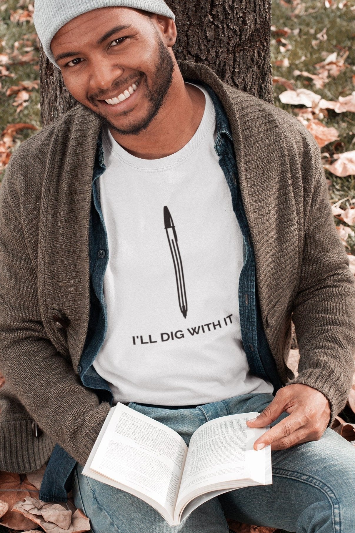 Seamus Heaney-inspired T-shirt with I'll Dig with it text. Made from premium cotton, featuring earthy colors and tasteful typography. Perfect for literature lovers and gardeners. A unique and thoughtful gift.